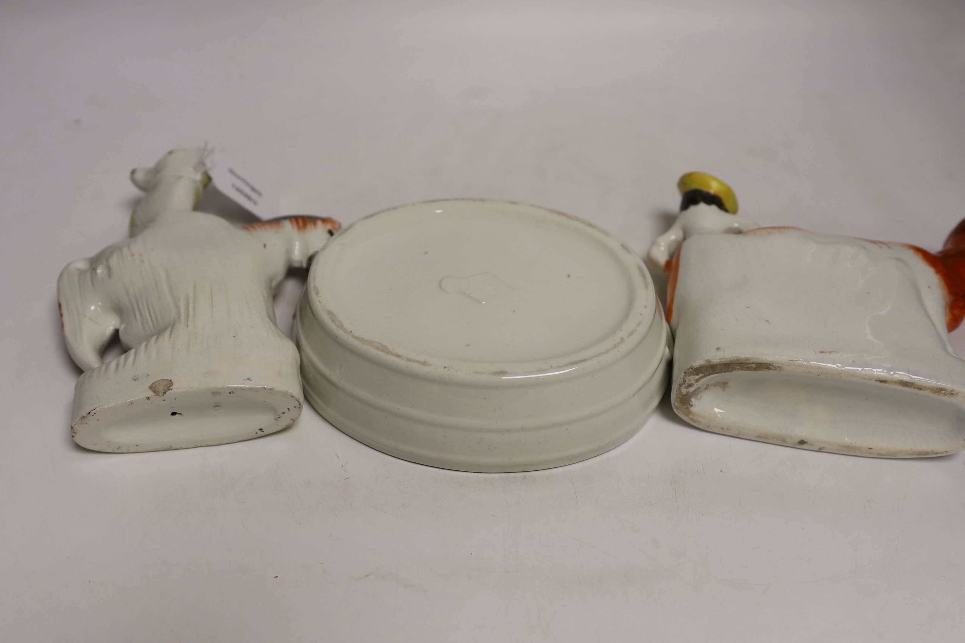 A Victorian Staffordshire cow tureen and cover, and five other Staffordshire figures, largest 18cm wide
